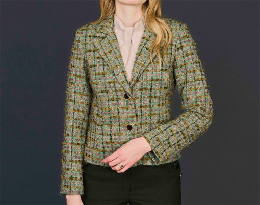 Green and brown woman wool boucle jacket with black Chanel-style buttons.