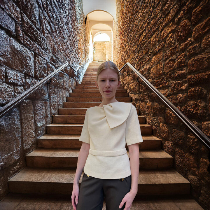 Off-white top by Thi Thao Copenhagen with shoulder detail